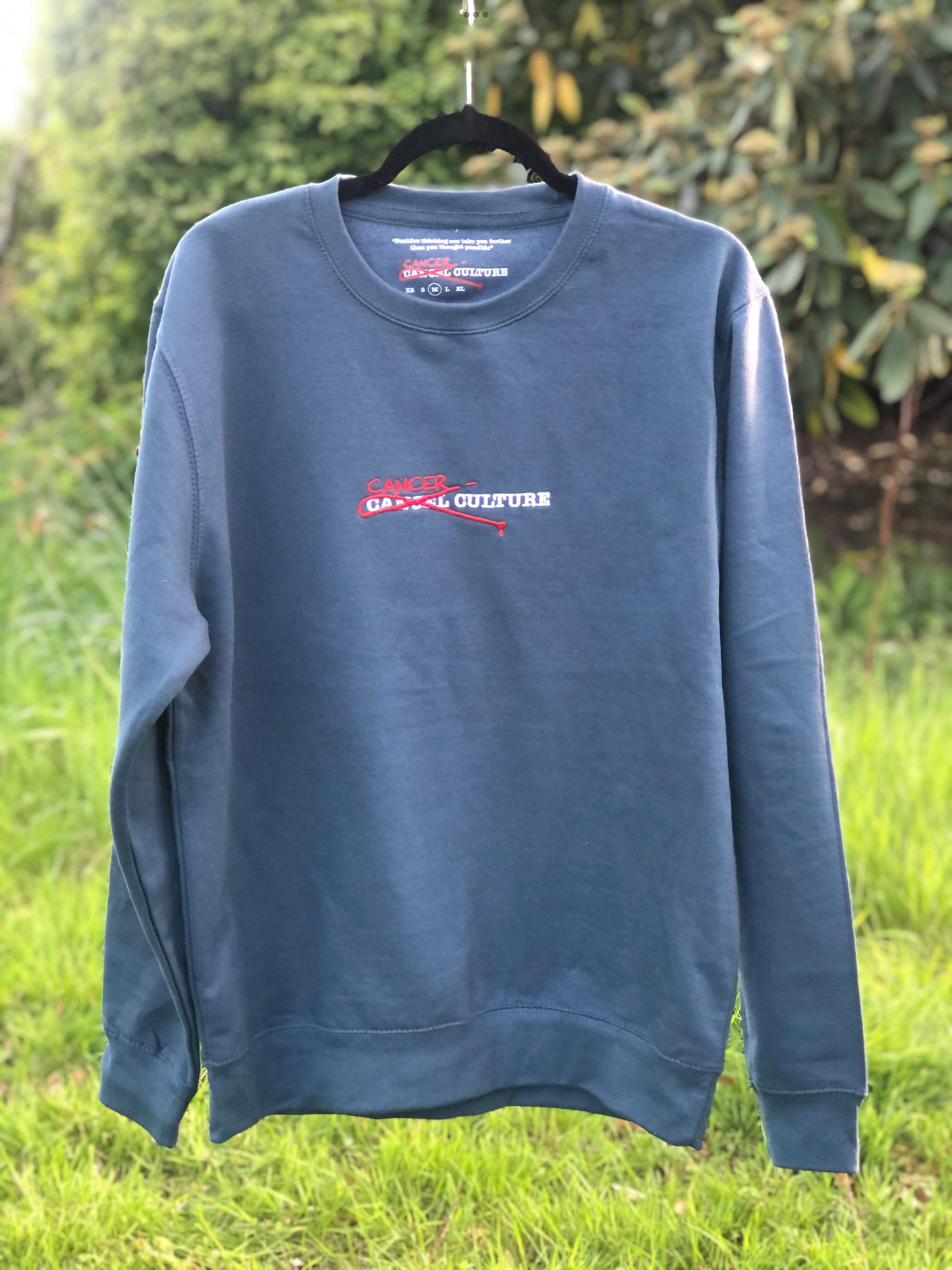 Long Sleeve Sweatshirt. Embroidered logo with inner message